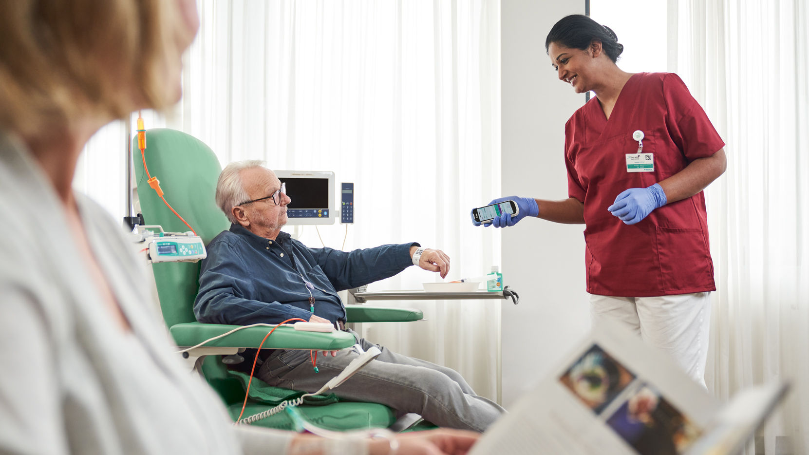 nurse-with-gloves-scanning-patient-identification-on-wristband.16-9.jpg