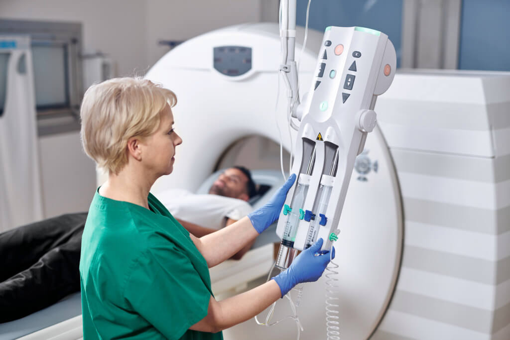 Nurse and Introcan Safety 3 with Background Patient